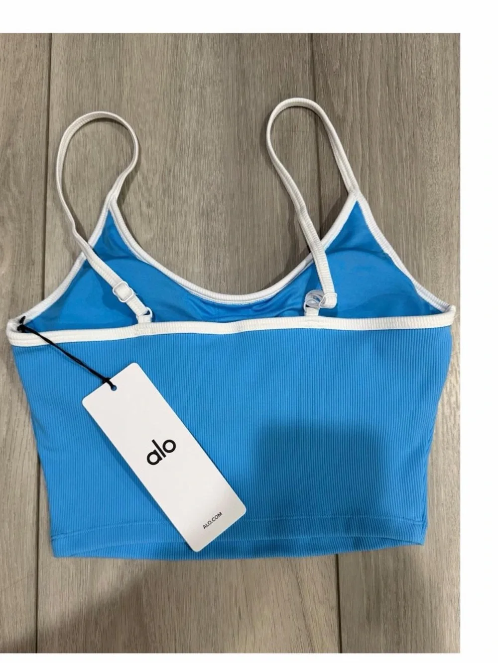 ALO Yoga Goddess Ribbed First Pick Bra Tank in Azure Blue with White Trim.